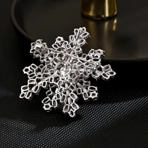 Elegant double-layer snowflake brooch featuring sparkling pink gems for romantic fashion style.