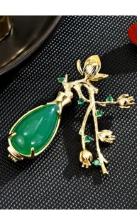 Exquisite plum blossom vase brooch detail, green chalcedony stone with gold branches.