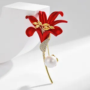Classic elegant red lily flower brooch with gold plating, sparkling crystals, and pearl accent.