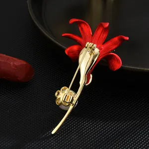 Elegant red lily flower brooch with gold plating and pearl detail, stylish fashion pin accessory
