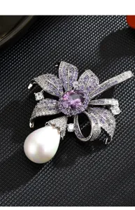 Elegant purple crystal pearl brooch detail, luxury floral design for women coat accessory.