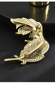 Elegant gold leaf brooch detail shot, exquisite rhinestone inlaid corsage pin for women.