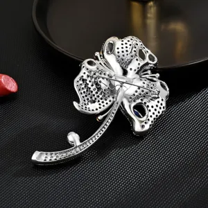 Elegant blue flower brooch for women, sparkling rhinestone fashion corsage accessory pin.