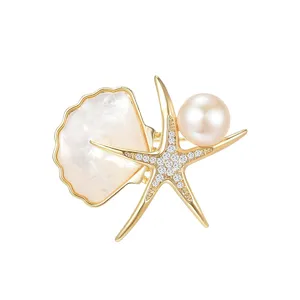 Elegante spilla stella marina con perla d'acqua dolce madreperla placcata oro cristallo