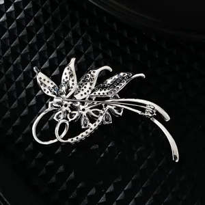 Exquisite micro-set zircon brooch for women, elegant silver-toned floral corsage pin accessory.