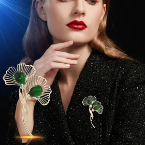 Elegant ginkgo leaf brooch with green stone crystal gold tone main view display