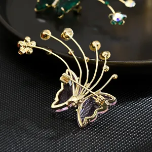 Elegant butterfly zircon brooch, delicate metal flower pin, perfect suit dress accessory.