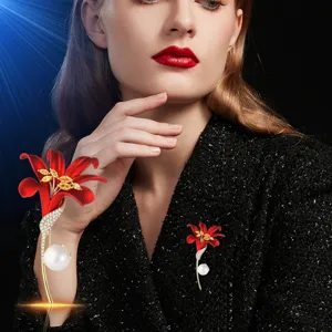 Red lily brooch for women with gold plating, pearl and rhinestones. Fashion accessory.