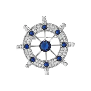 Men's stylish ship helm brooch pin with cubic zirconia and blue stones for suit coat apparel.