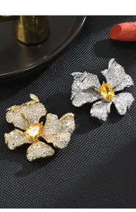 Exquisite crystal butterfly brooch detail view, sparkling zircon with yellow stone.