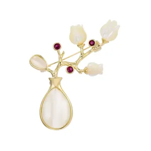 Elegant vintage gold-plated vase flower brooch with mother of pearl and cat eye.