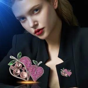 Exquisite double strawberry brooch with pink zircons and green enamel leaves. Chic jewelry.
