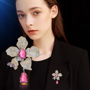 Exquisite luxury ruby flower brooch with sparkling crystals and elegant drop design for women.