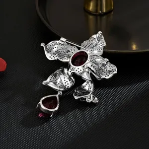Exquisite silver-tone red gemstone flower phoenix tail brooch for elegant retro coats.