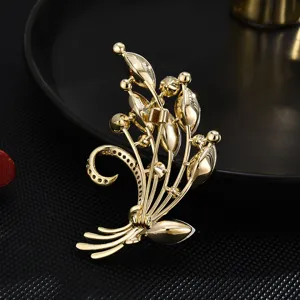 Exquisite gold-plated bouquet brooch with sparkling zirconia, elegant women clothing accessory.