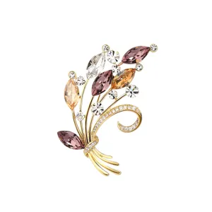 Elegant crystal bouquet brooch for women, gold plated fashion jewelry accessory.
