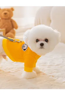 Cute winter pet dog hoodie with leash ring, warm two-legged yellow apparel for small puppies.