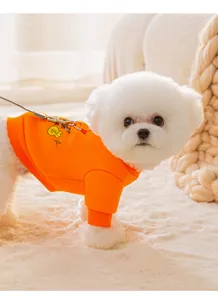 Cute pet hoodie detail, bright orange dog sweater with cartoon print and leash ring.