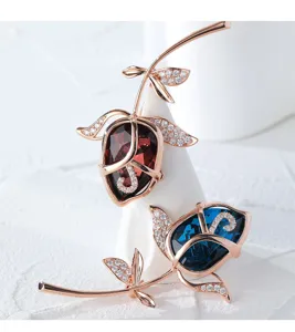 Close-up detail of the elegant rose brooch featuring sparkling crystals and rose gold finish.