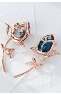 Rose crystal brooch jewelry detail, elegant floral pin accessories for women.