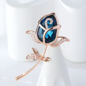 Elegant deep blue crystal rose brooch with sparkling rose gold cubic zirconia details