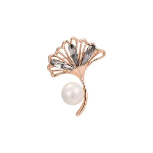 Elegant ginkgo leaf brooch featuring crystal and pearl, perfect for coat and suit accessory.
