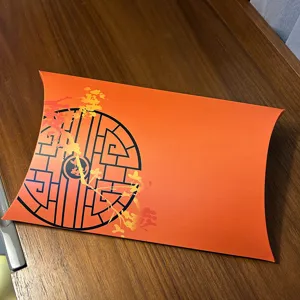 Orange pillow gift box for silk scarves and presents, stylish Chinese lattice pattern design.