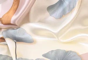 Detailed close-up view of women elegant satin square scarf with soft floral print fabric
