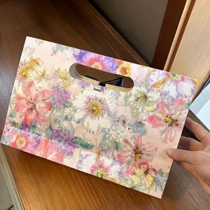 Envelope gift box with watercolor floral print and ribbon handle for silk scarves and presents.