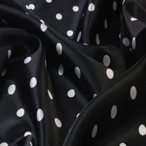 Black and white polka dot satin silk scarf fabric detail close-up texture view soft material
