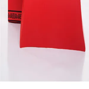 Red gift box packaging detail, elegant cardboard box for scarves, shirts and gifts.