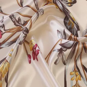 Close up view of floral print satin silk scarf, showing elegant vintage botanical pattern.