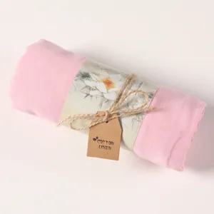 Pink cotton linen scarf detail, soft rolled shawl texture close up, elegant solid color.