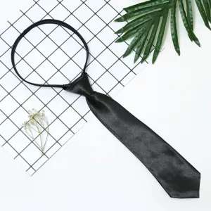 Detail view of a black pre-tied short tie, featuring smooth satin finish and convenient zipper.