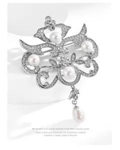 Luxurious baroque style pearl brooch with sparkling rhinestones and elegant hanging tassel.