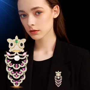 Exquisite Chinese style lion dance brooch with sparkling crystals and pearls for women.