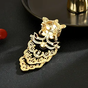 Elegant Chinese style lion dance brooch for women, gold tone alloy with red accents.