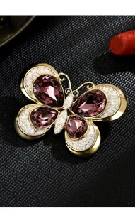 Exquisite crystal butterfly brooch, gold-tone metal with stunning purple teardrop stones.