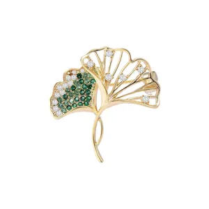 Elegant double ginkgo leaf brooch with green and white zircon, luxury suit accessory for women.