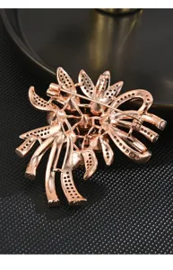 Detailed view of elegant rose gold tone brooch back clasp, exquisite craftsmanship for dresses.