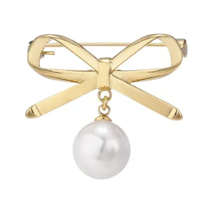 Elegant gold-tone bow brooch featuring a dangling white pearl charm, perfect for daily wear.
