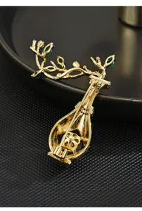 Detail view of vintage Chinese style gold vase brooch back showing delicate metal craftsmanship.