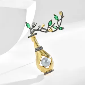 Elegant vintage Chinese style vase pearl brooch with two-tone gold and green crystal leaves.