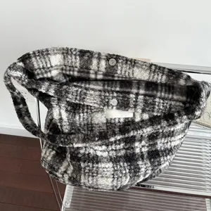 Vintage black and white striped plush tote bag showing large capacity interior for winter