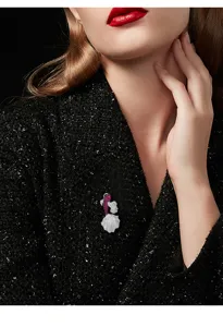 Exquisite koi fish brooch detail, sparkling crystal and ruby-tone gems for elegant suit coat.