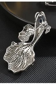 Detailed view of the back of a luxurious koi fish brooch, featuring fine metalwork pin.