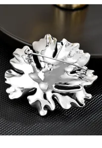 Close-up detail of the silver-tone metal peony flower brooch back, showing secure pin and clasp.
