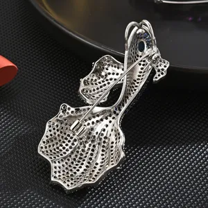 Silver tone goldfish brooch pin back view, elegant crystal rhinestone detailing for women coats.
