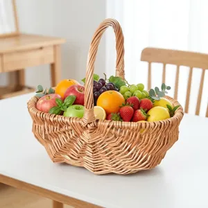 Detailed view of a handmade willow picnic basket filled with fresh assorted fruits.