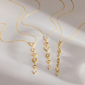Gold stainless steel Y-shaped long tassel necklace set with sparkling multi-shape cubic zirconia.